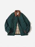 Green casual jacket with side seam pockets on a hanger, showing regular fit and long sleeves.