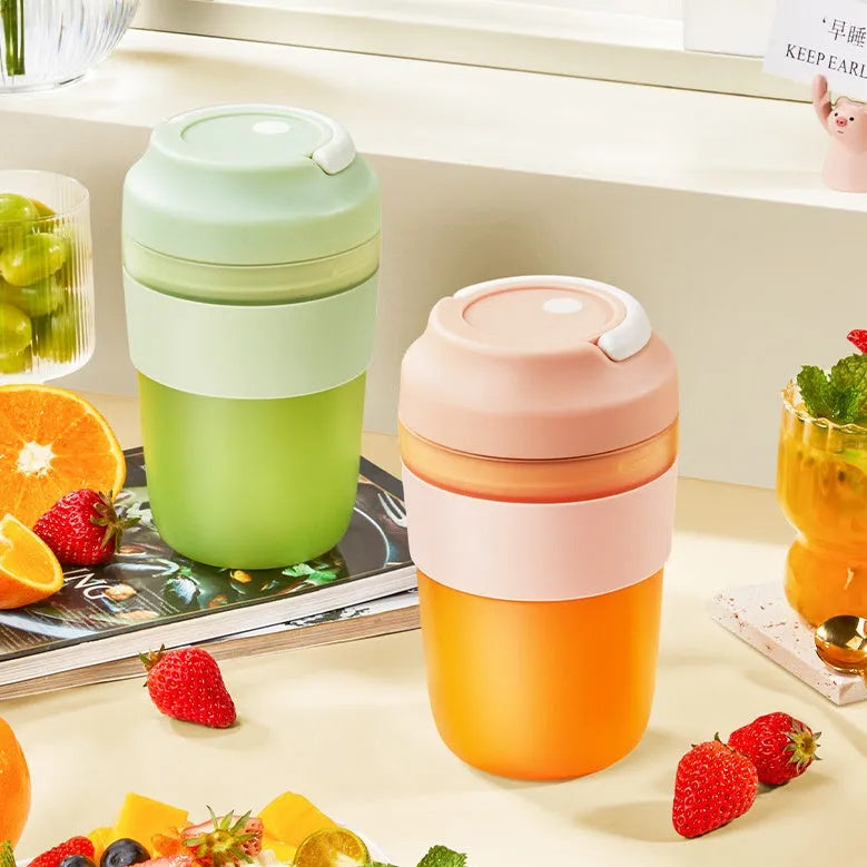 Portable rechargeable blender juicer cup 400ml capacity with four stainless steel blades in purple, green, and orange colour options