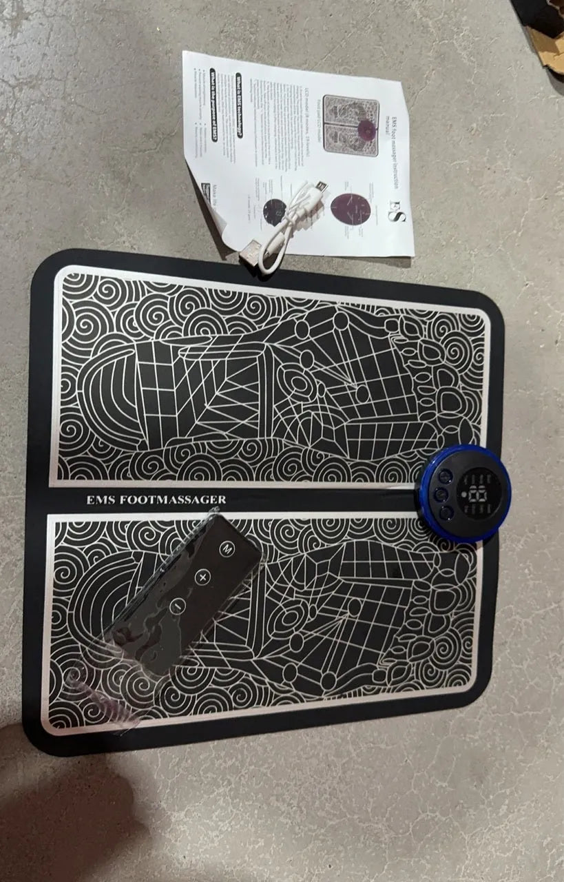 Pulse micro-current foot massage cushion with leather surface, LCD screen, and wireless remote control.