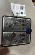 Pulse micro-current foot massage cushion with leather surface, LCD screen, and wireless remote control.