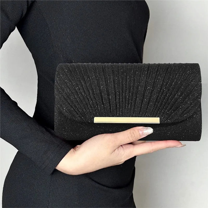 Women's hardware edge fine pink pattern PU clutch bag on a flat surface