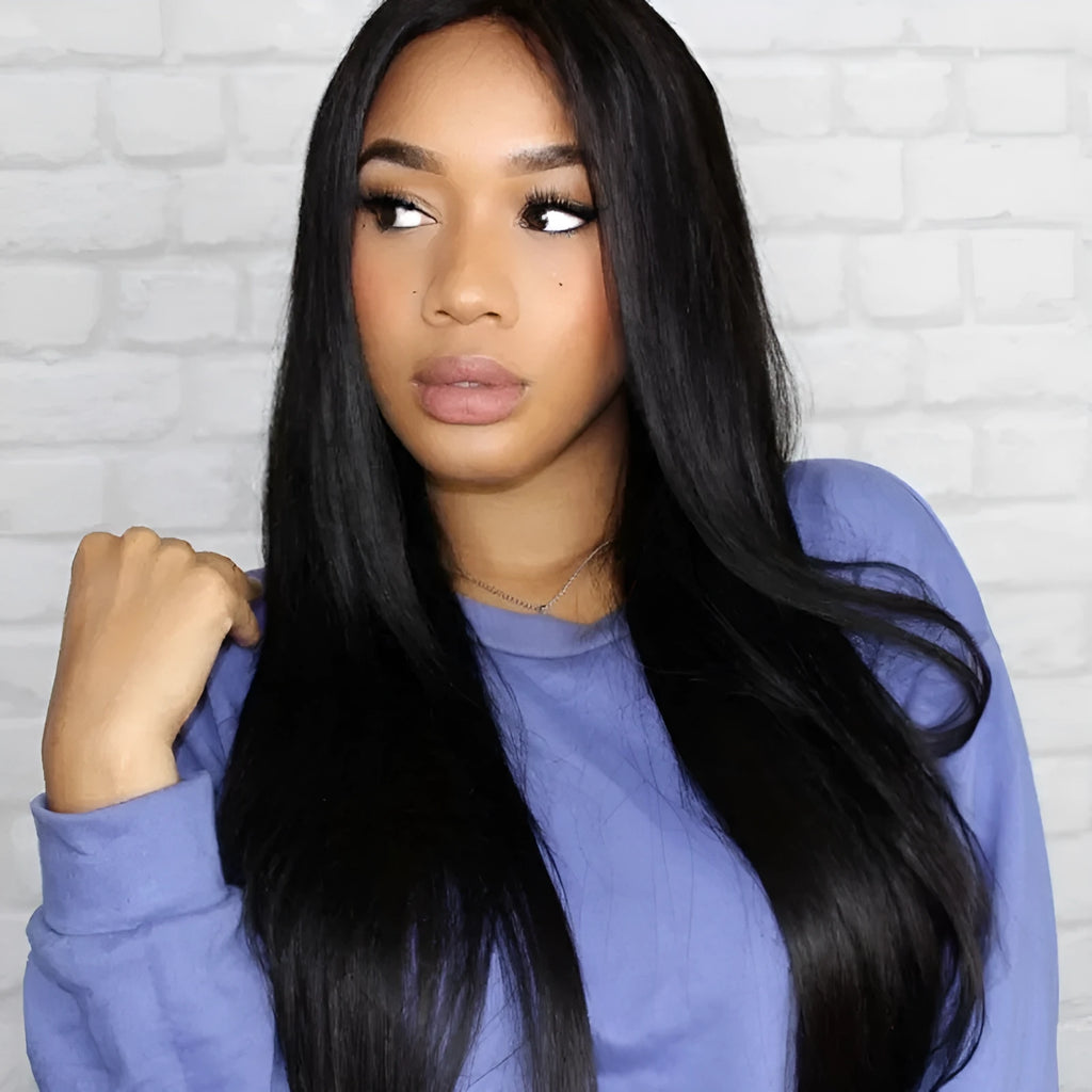 Long straight black synthetic ladies wig with a centre part, displayed on a wig stand.