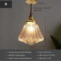Retro brass ceiling chandelier with a clear glass ball shade, showing copper construction.