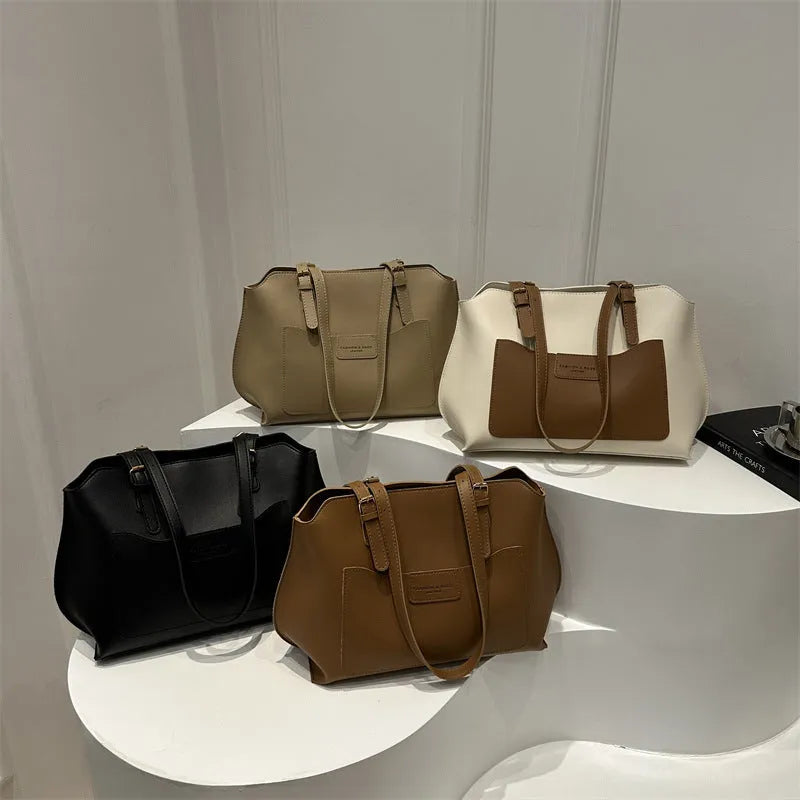 Horizontal square PU tote bag for women in black, showing external sandwich pocket and double shoulder straps.