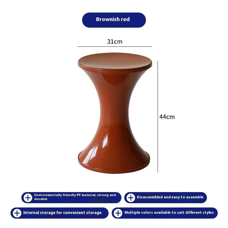 A plastic hourglass-style shoe changing stool shown in one of five available colours: black, green, red, white, or brown.