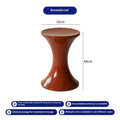 A plastic hourglass-style shoe changing stool shown in one of five available colours: black, green, red, white, or brown.
