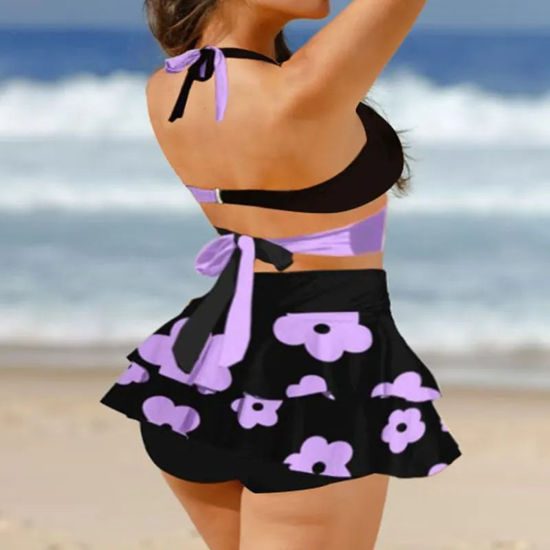 Women's purple lace-up bikini top and matching split skirt swimsuit set.