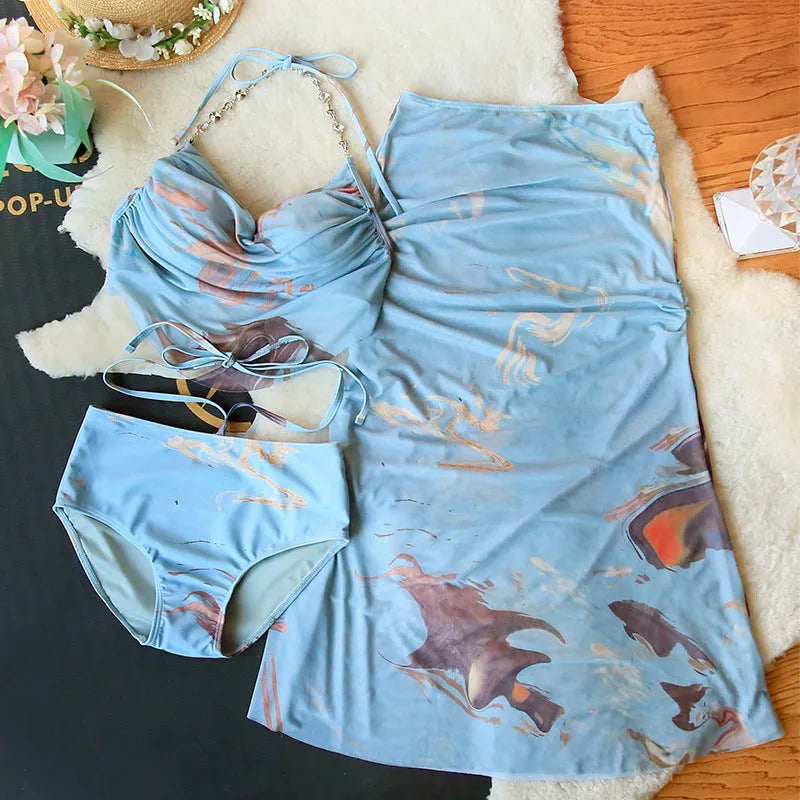 Women's blue printed bikini set with triangle top, high-waisted briefs and skirt showing steel support construction