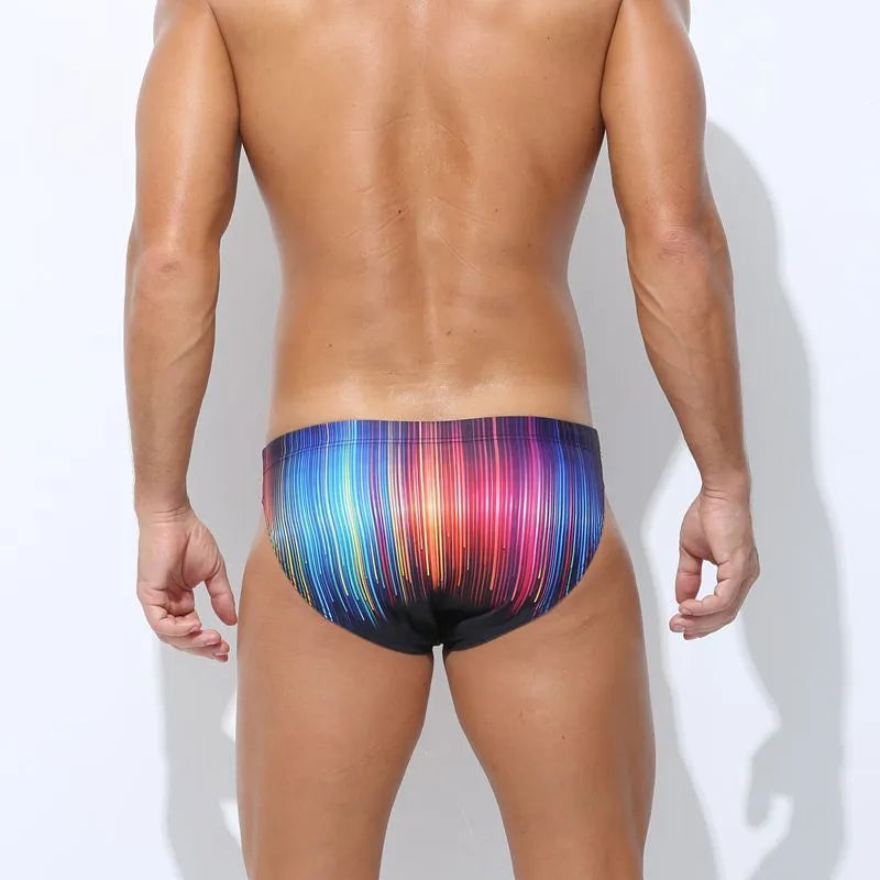 Men's printed swimming trunks in polyester fabric showing Cyber, Ice Cream, Streamer, and Skull pattern options.