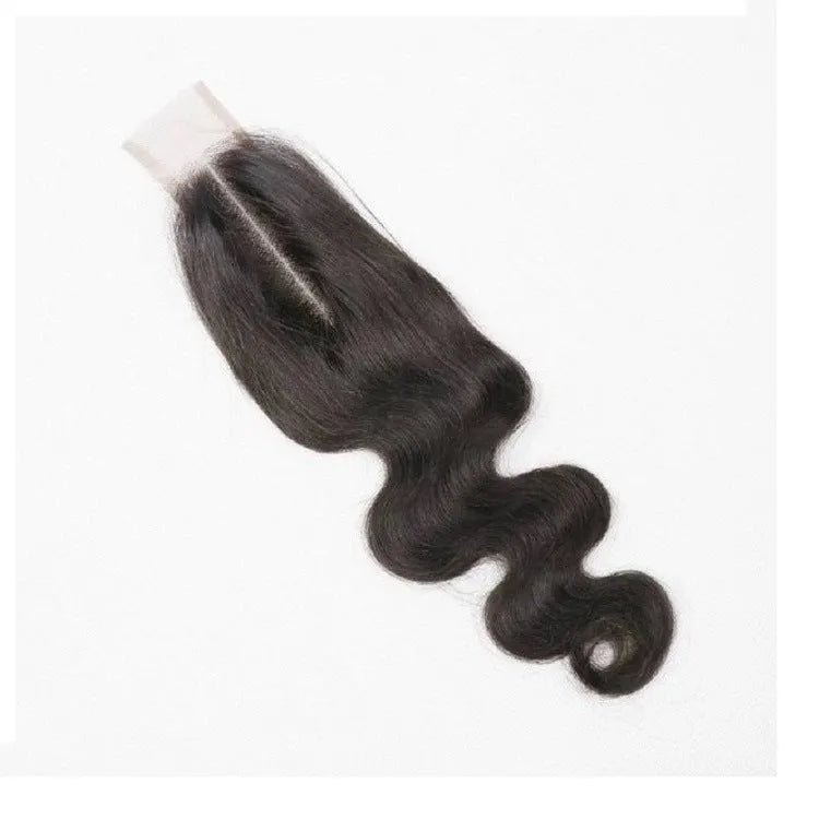 Straight natural colour human hair wig displayed on a stand, showing its length and exotic style.