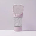Green 3-in-1 portable pet water bottle with food container and waste bag dispenser attached to a strap.