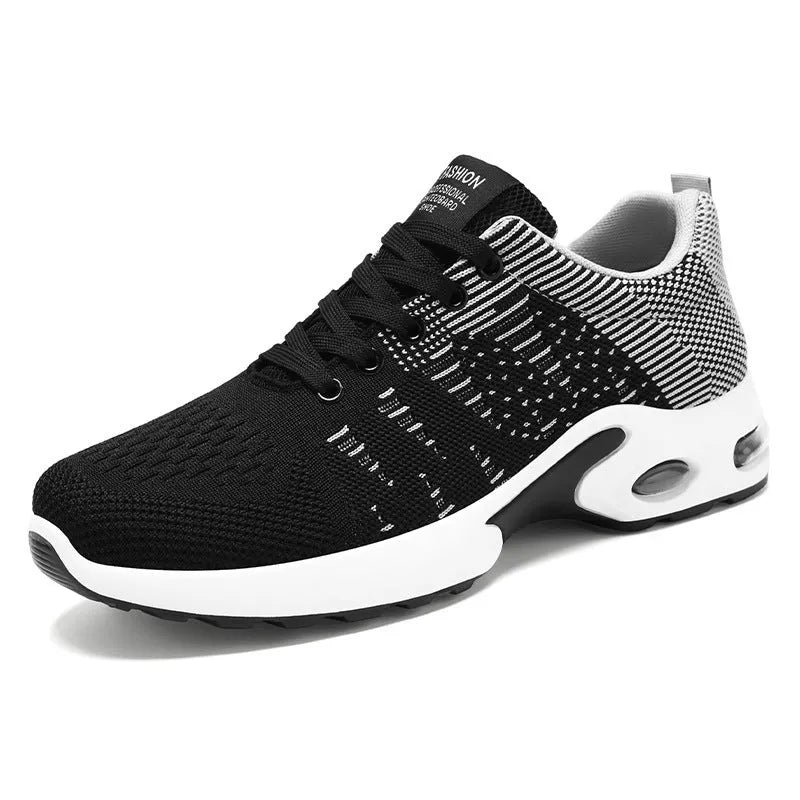 Men's black and grey Flyknit mesh low-top casual sneakers with lace-up front and soft sole.