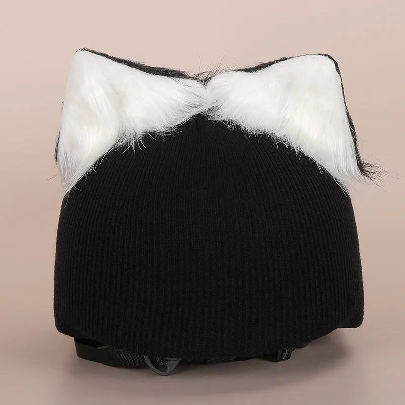 Soft plush cartoon character cover on a motorcycle helmet, showing size M and decorative ear sections.