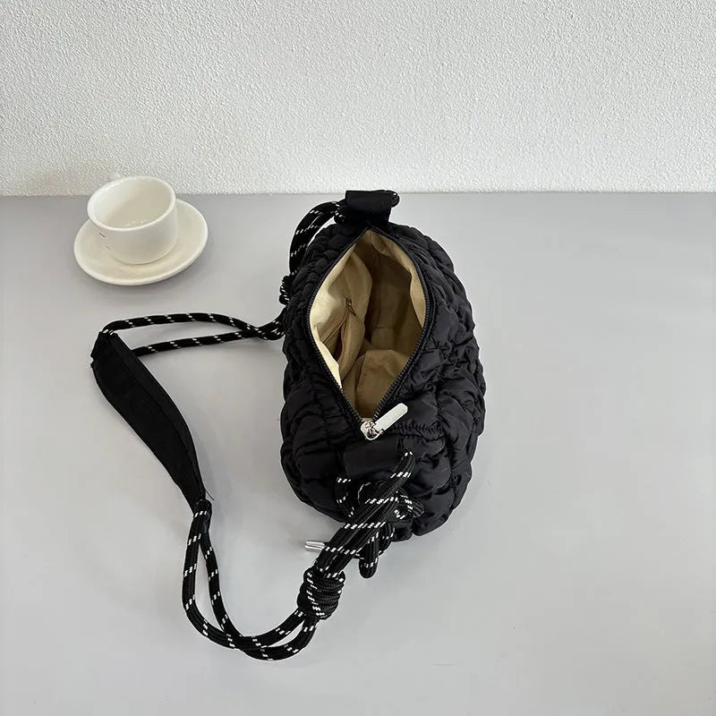 Women's lightweight nylon messenger bag in pillow shape with diamond quilted pattern