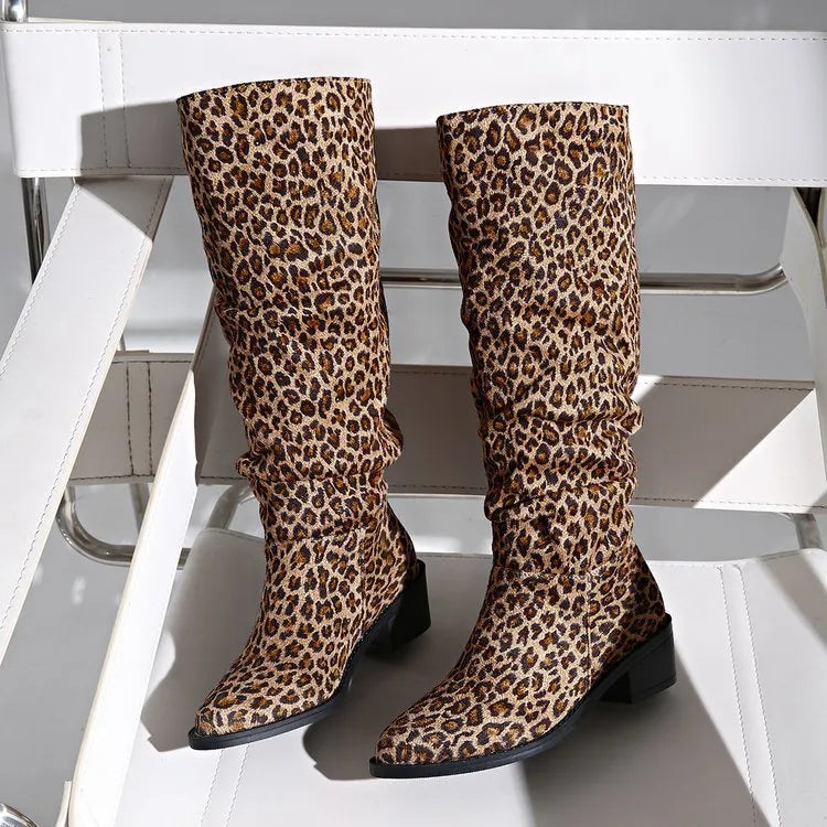 Brown women's leopard print ankle boots with a square toe and chunky mid-heel on a plain background.