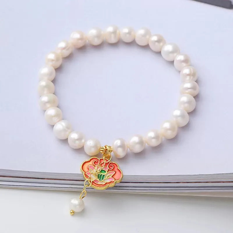 White freshwater pearl goldfish and lotus bracelet with vintage baroque design on delicate chain