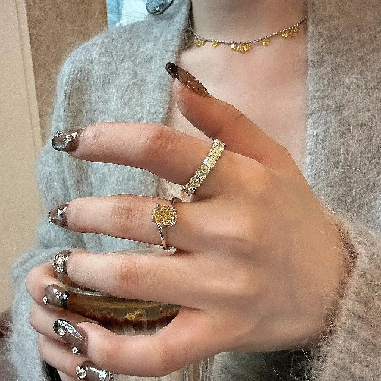 Women's yellow rock sugar crystal ring on copper band showing detail of crystal design