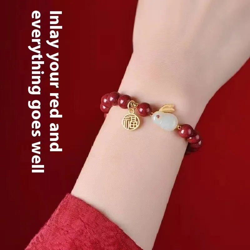 Purple gold sand cinnabar bracelet with a jade hare charm, shown with 6mm and 8mm bead size options.