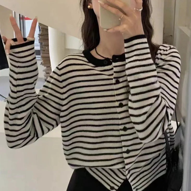 Dark grey and white striped women's slim-fit cardigan coat with long sleeves, shown on a model.