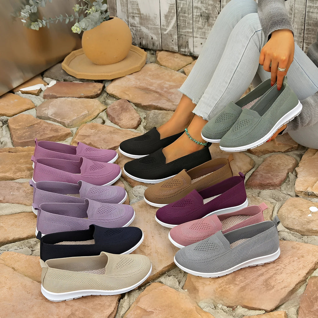 Plus size women's low-top leisure cloth shoes in beige with a heart-shaped pattern and flat sole.