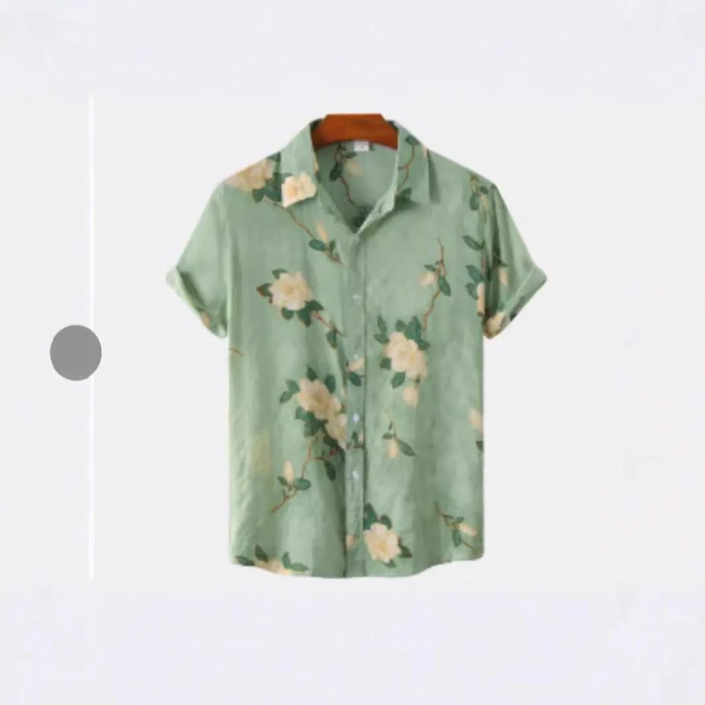 Man wearing a short sleeve Hawaiian print shirt with lapel collar in a floral pattern.