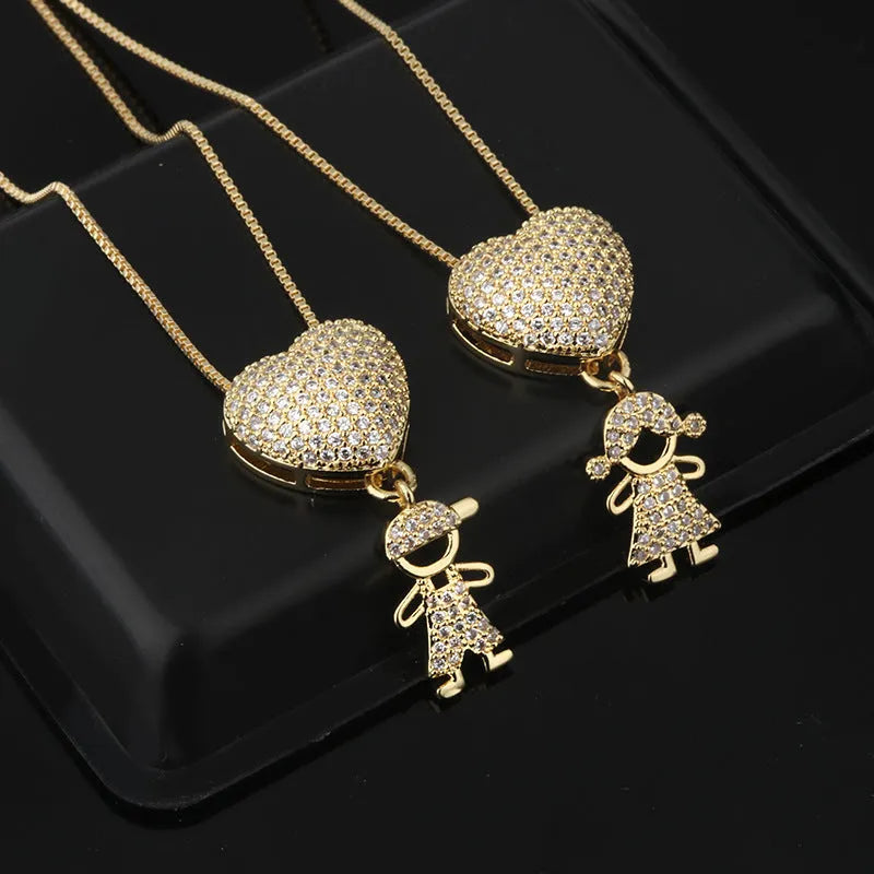 Gold colour copper heart pendant necklace with zircon inlays on white background