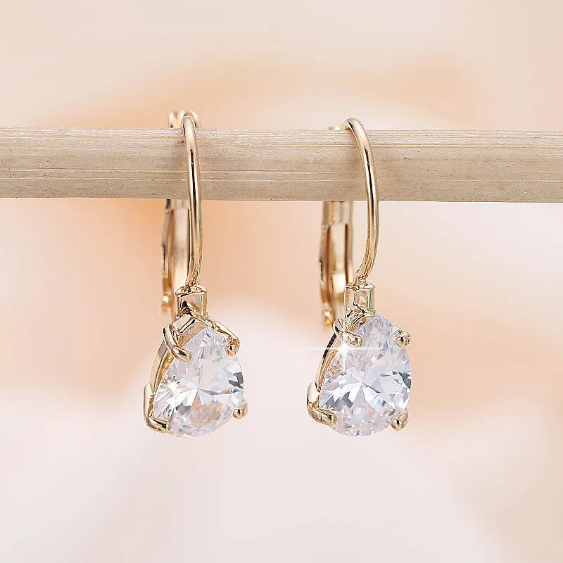 Women's drop-shaped copper earrings with gemstone inlay in gold or platinum colour options