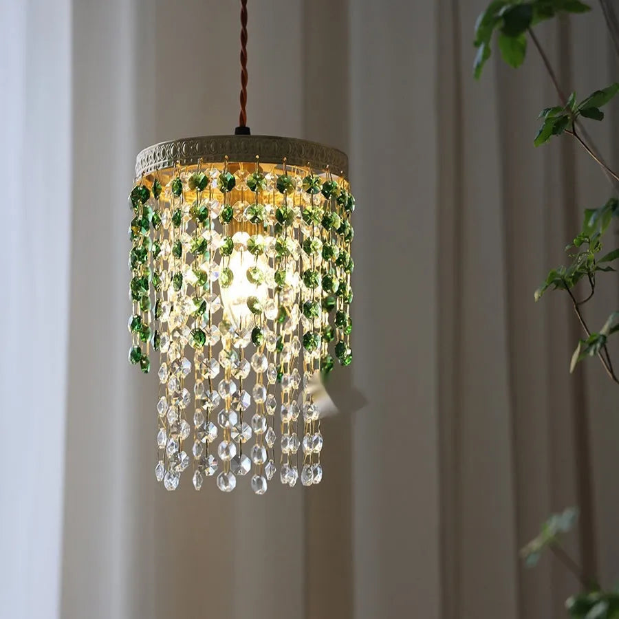 Retro green glacier bedside crystal small droplight with light luxury style on a wooden surface