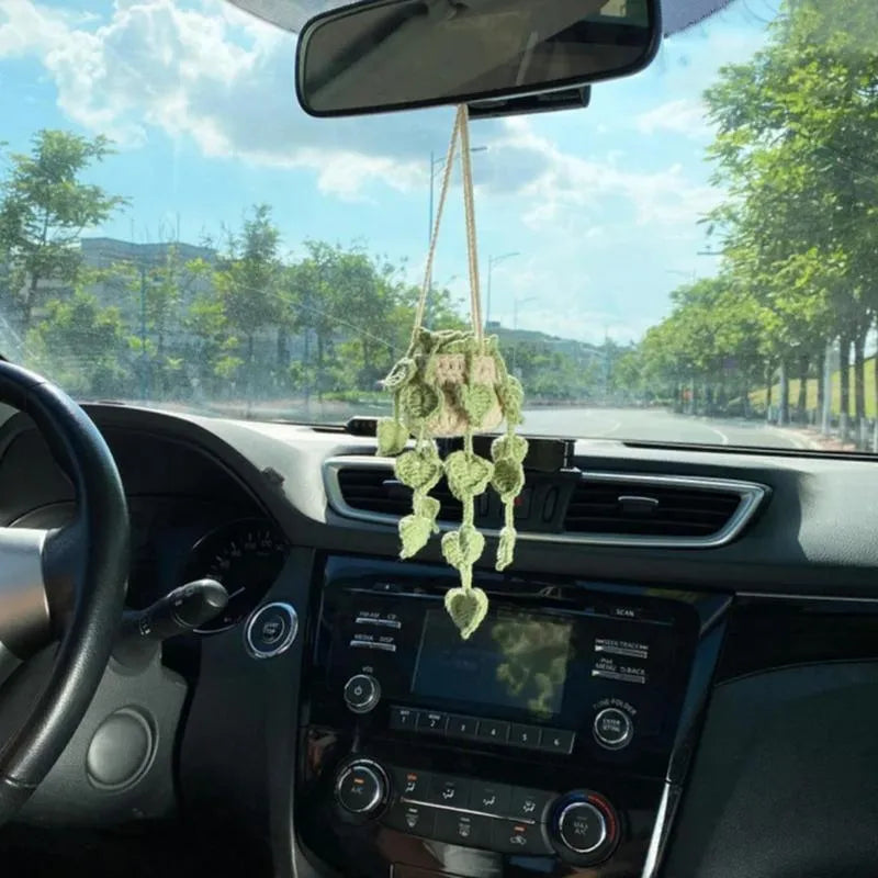 Green and white knitted wool plant ornament for car dashboard with hanging cord