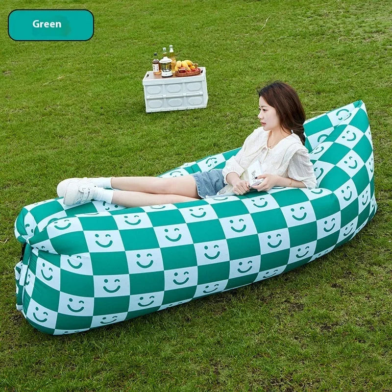 Portable inflatable sofa in folded position showing Oxford cloth material and compact 36cm x 27cm dimensions