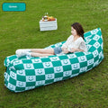 Portable inflatable sofa in folded position showing Oxford cloth material and compact 36cm x 27cm dimensions