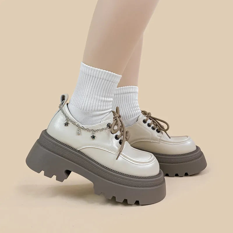 White platform Mary Jane shoes with chunky heel and lace-up front