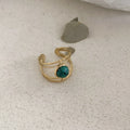 Geometric open ring with green natural stone centrepiece and titanium steel electroplated alloy band