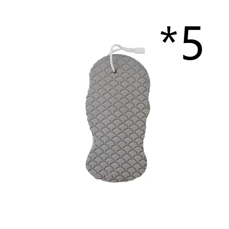 White 3D bath sponge with fish scale pattern for gentle body exfoliation in shower.