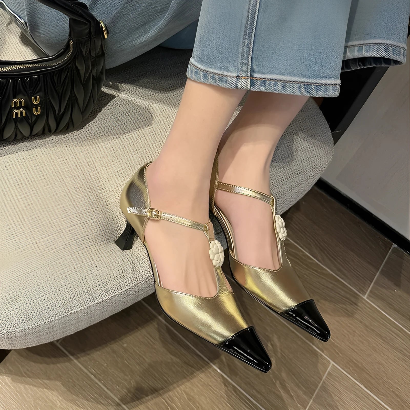 Gold women's pointed toe stiletto heel shoes with flower buckle decoration on ankle strap
