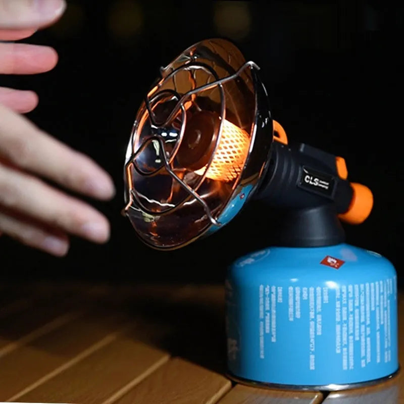 Black and orange portable outdoor camping heater with automatic ignition on a stainless steel and plastic body.