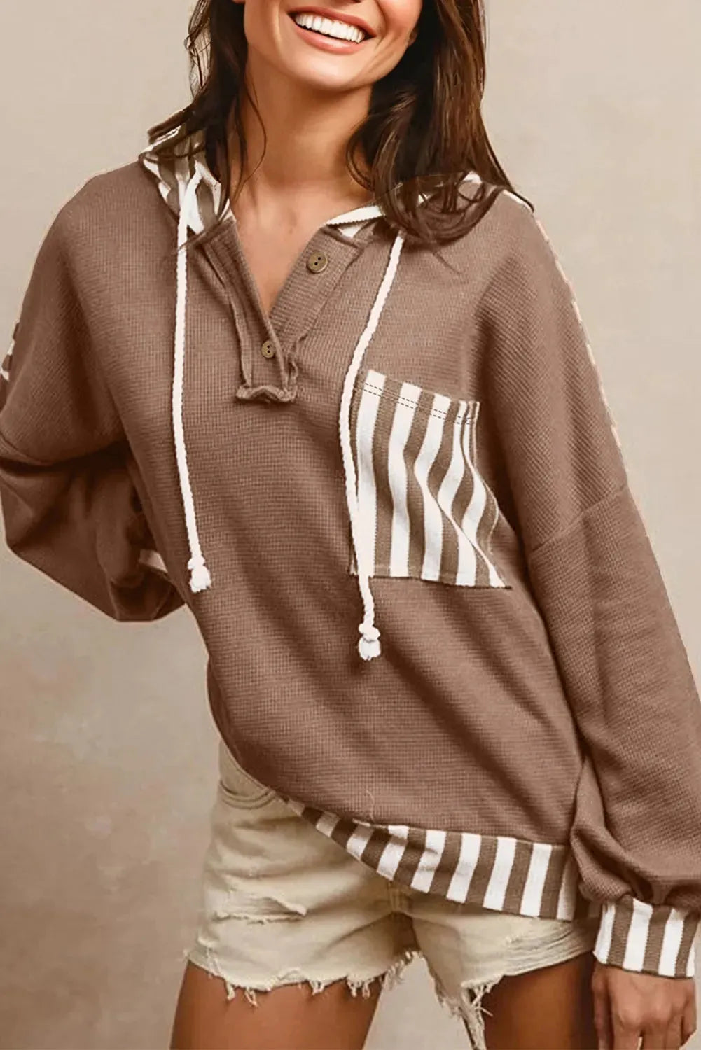 Straw yellow striped patchwork hoodie with a waffle texture and button neck drawstring.