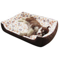 Beige plush dog bed with raised edges and removable cushion for small pets