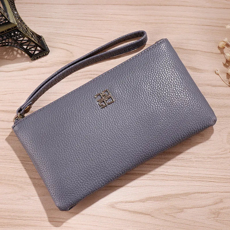 Long chain crossbody phone wallet handbag in PU leather available in multiple solid colours.