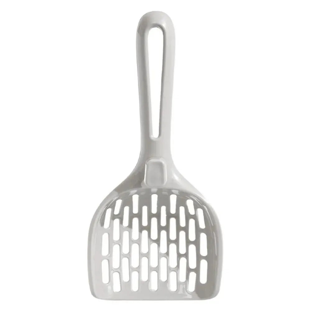 Grey plastic cat litter scoop sitting in its matching base tray