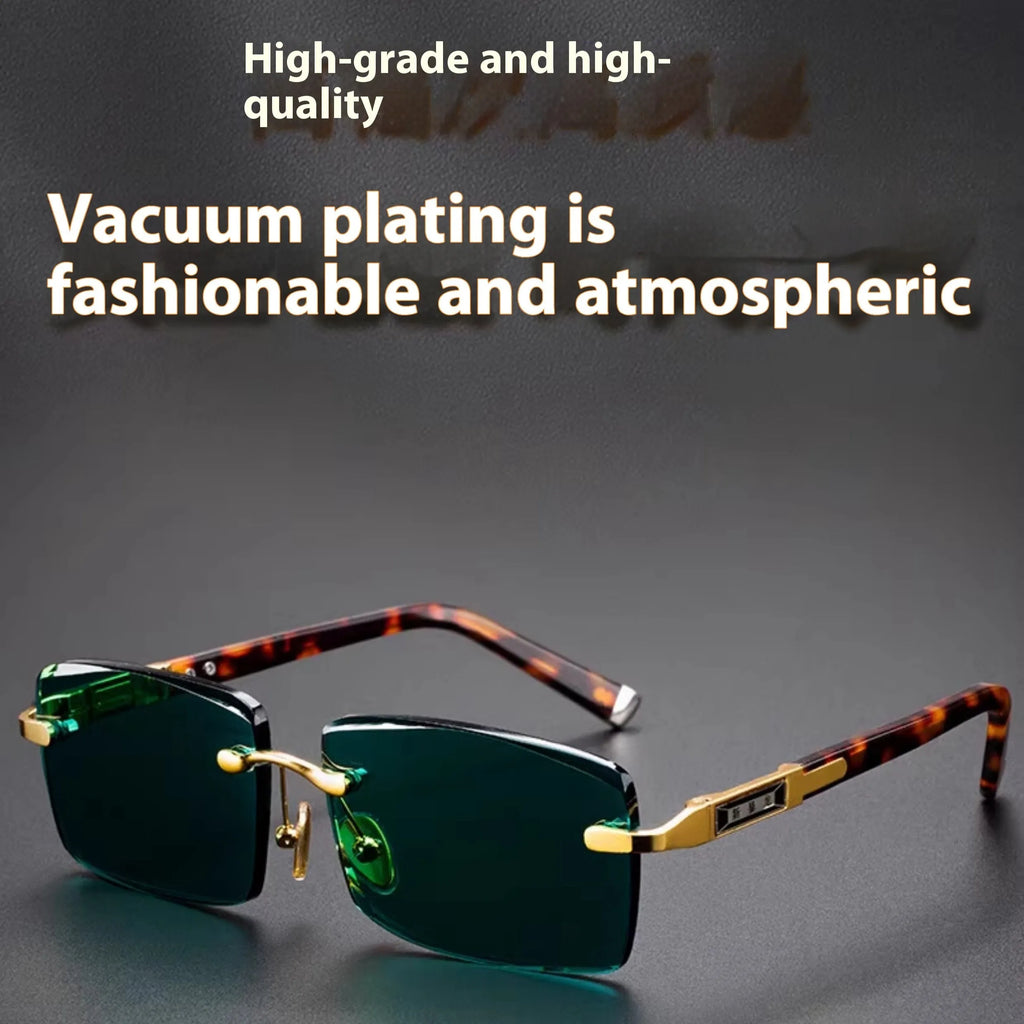 A pair of dark green frameless crystal sunglasses with a hard case and a lens cloth on a plain background.