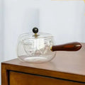 Transparent borosilicate glass teapot with wooden handle and removable infuser for rotary tea brewing