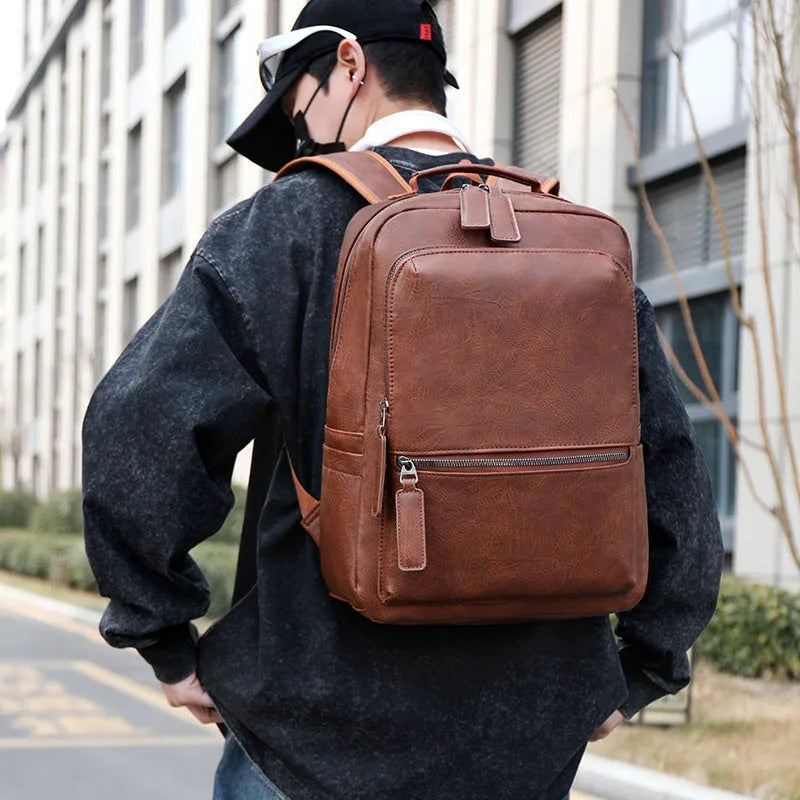 Men's vintage waterproof PU leather backpack in solid colour with retro style, capacity 20-35 litres