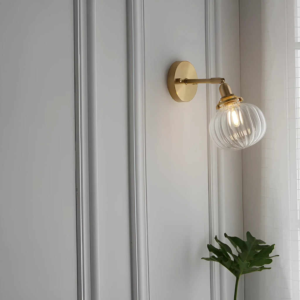 Glass wall lamp with a transparent or blue shade for living room or bedroom.