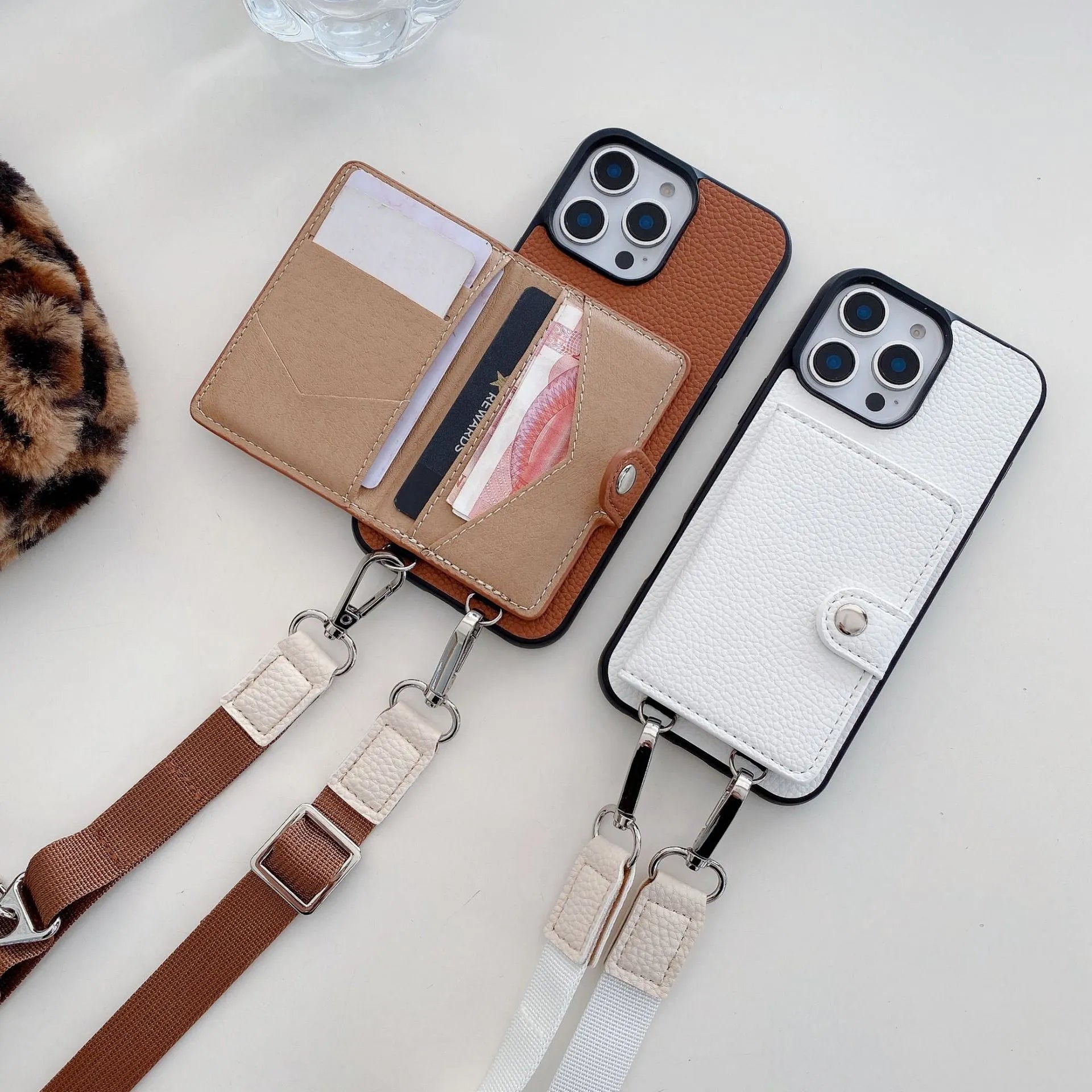 Black PC leather iPhone case with a detachable card holder and lanyard attached.