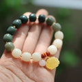 Gradient white jade Bodhi root bracelet with 10mm flower beads and natural beeswax lotus detail