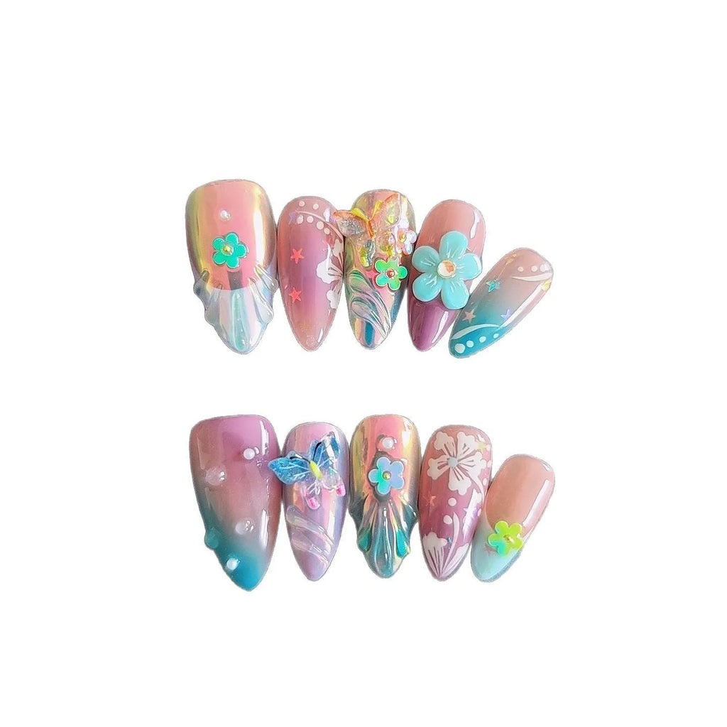 Handmade colourful flower and butterfly sculpture nail art stickers on almond-shaped false nails.