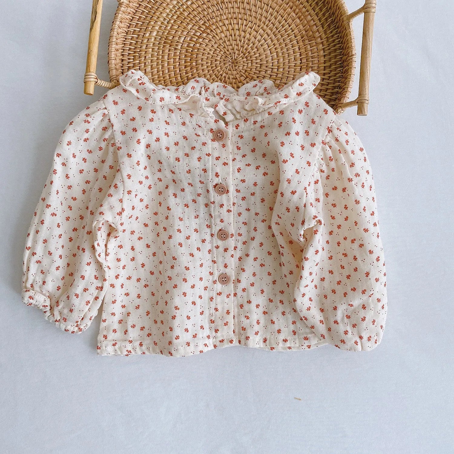 Apricot coloured baby romper with pleated lotus leaf design and sling climbing suit style for 0-2 year olds.
