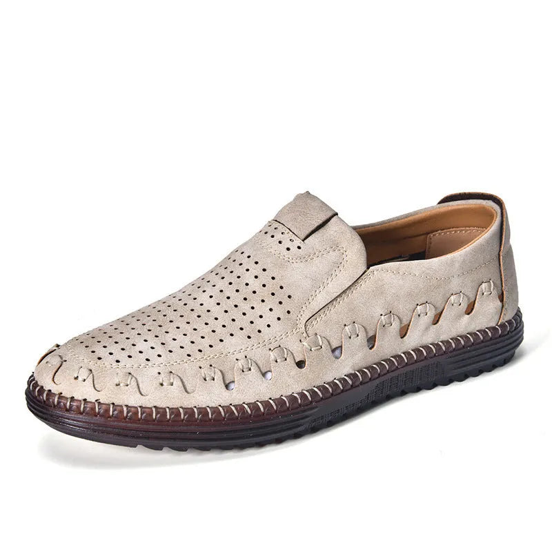 Men's brown casual slip-on shoes with round toe, low top, and sleeve entry design on a plain background.