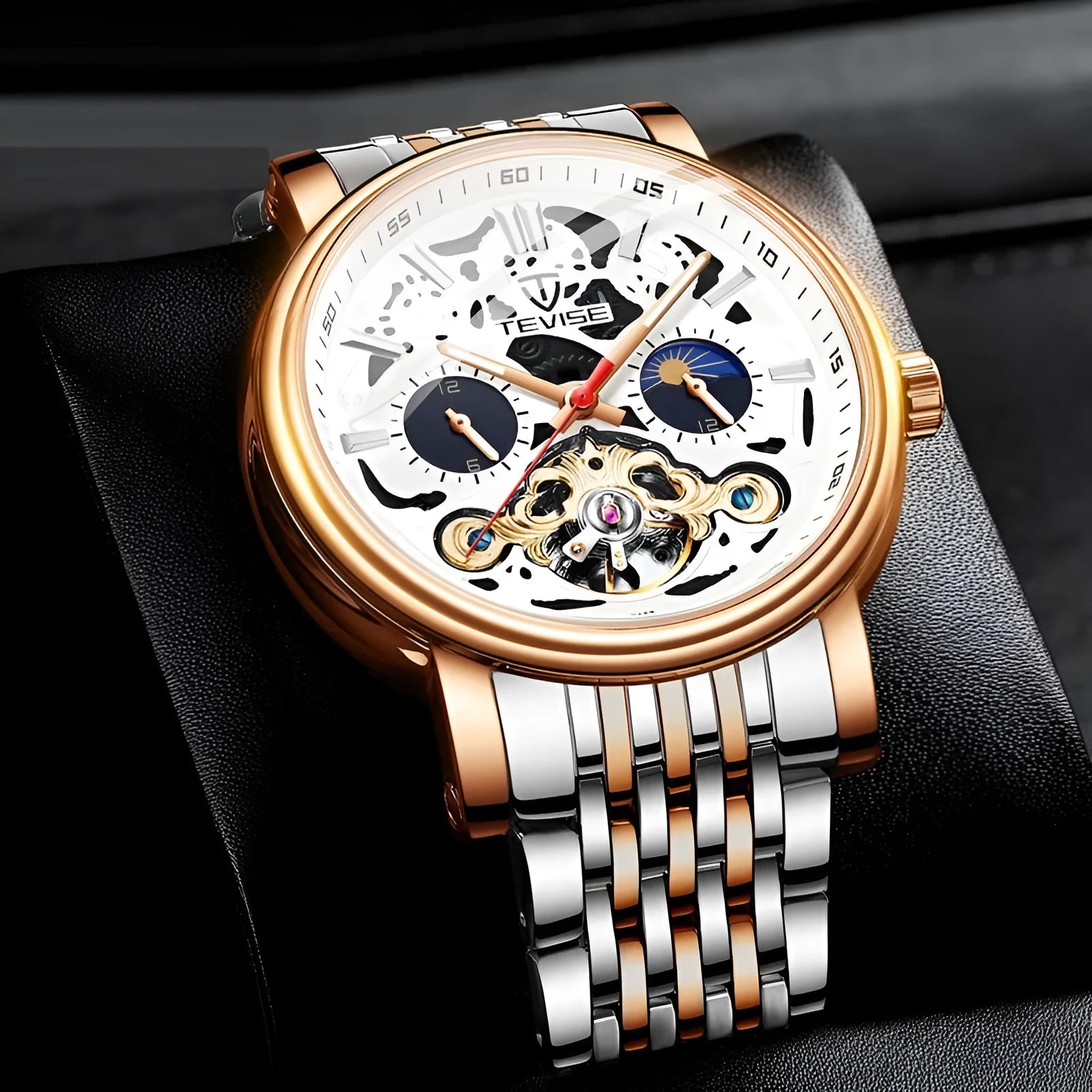 Men's black mechanical watch with tourbillon, luminous hands on a metal bracelet.